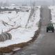 A farmer drives a tractor down a rural road on Jan. 17, 2019 near Ottawa, Ill.